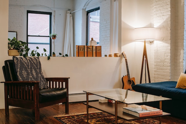 apartment living room with white walls and dark wood flooring